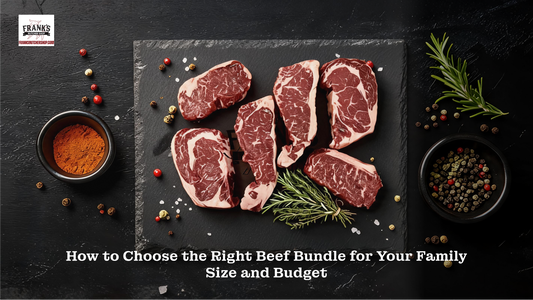 Multiple premium dry-aged beef steaks with visible marbling on dark slate board with red spice, and mixed peppercorns, Frank's Butcher Shop beef bundle.